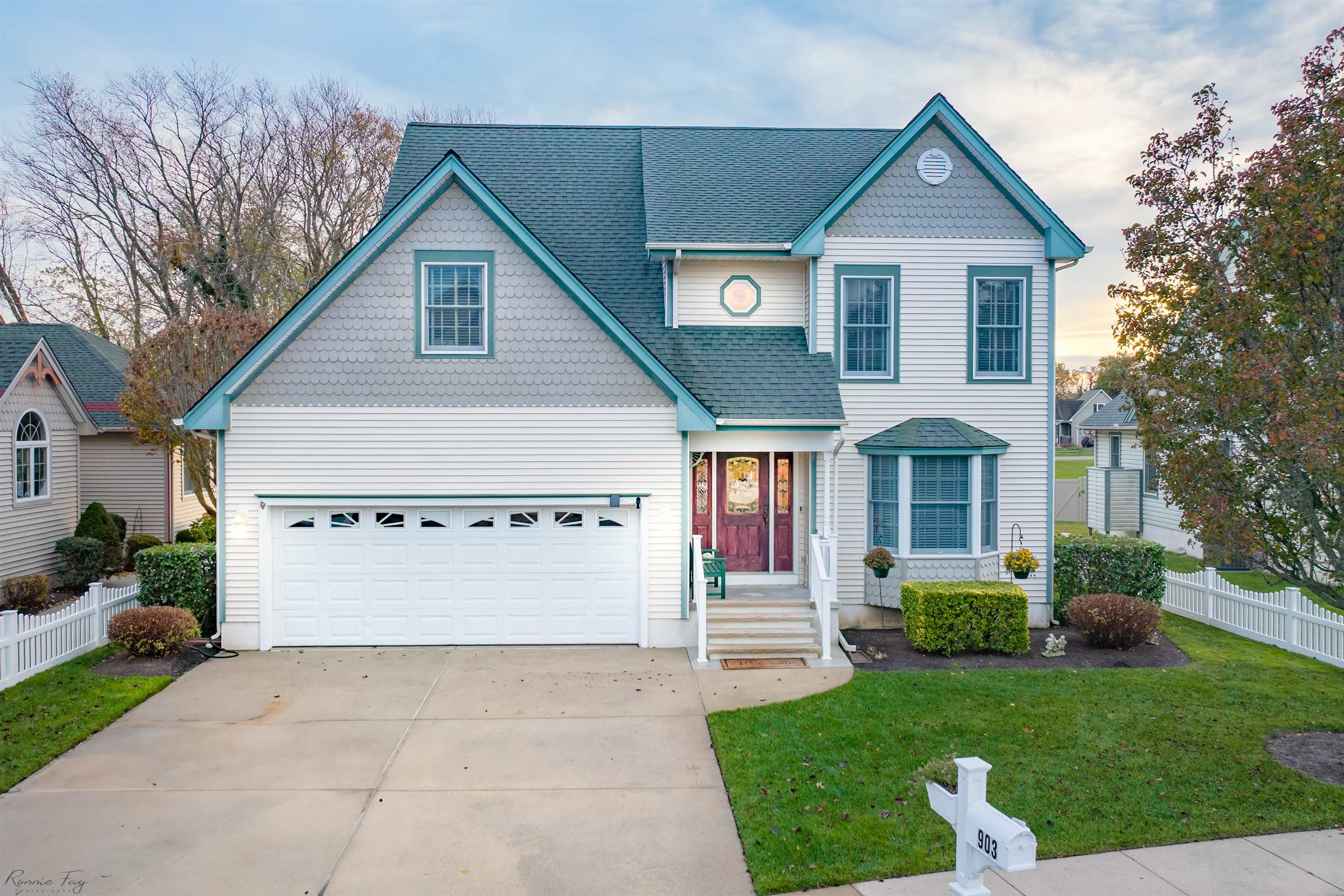 Two story gray and white house